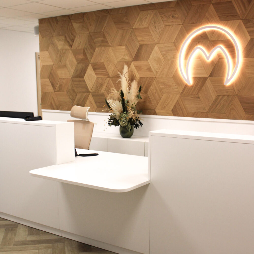 Wood panels as a backdrop for a reception logo. Read more about the project here.