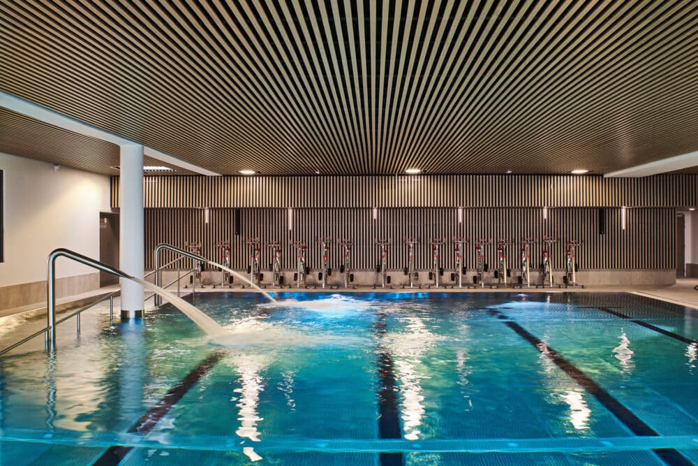 Laudescher: Elevating Olympic Infrastructure with Wood Pannels