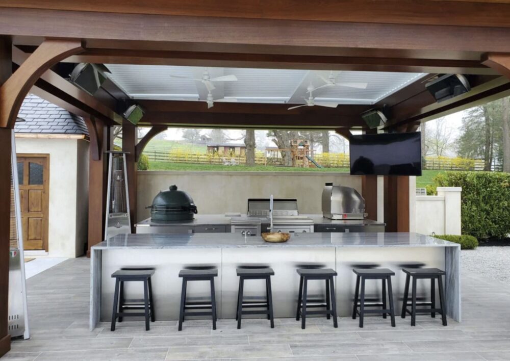 Outdoor kitchen with platinum heater. Courtesy of Backyard Oasis.